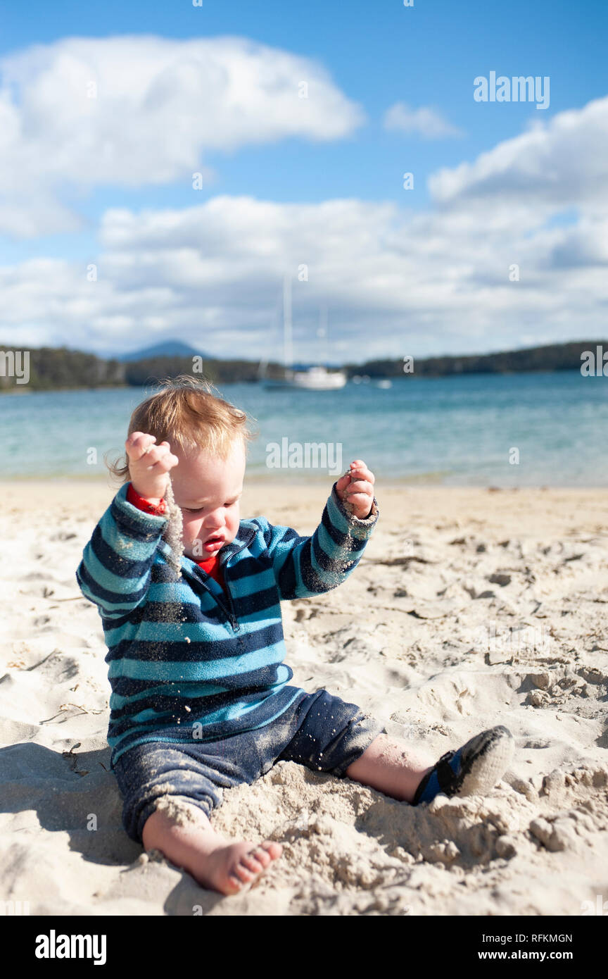 Toddler playing at the beach, Tasmania, Australia Stock Photo Alamy