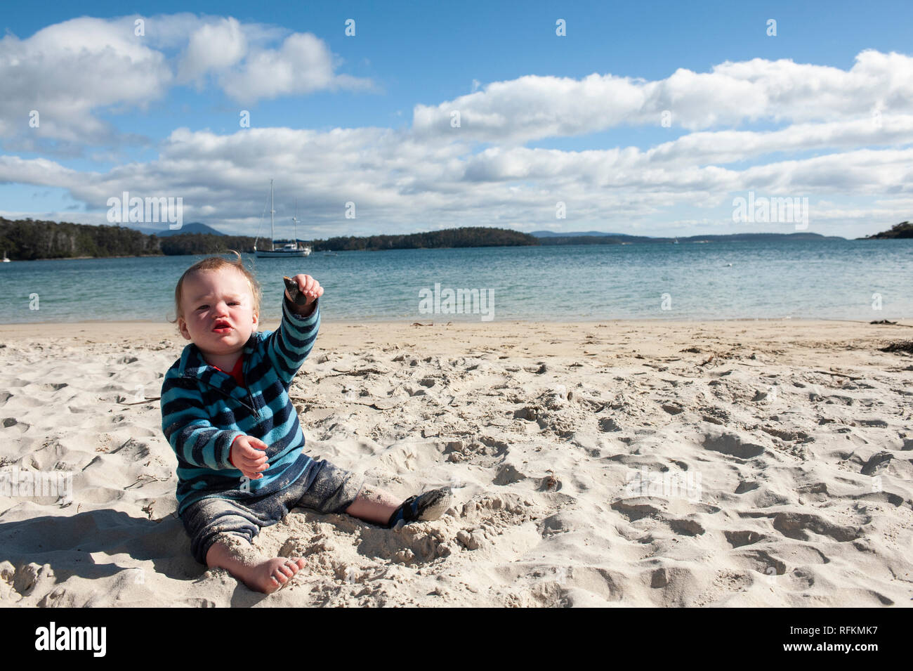 Toddler playing at the beach, Tasmania, Australia Stock Photo Alamy