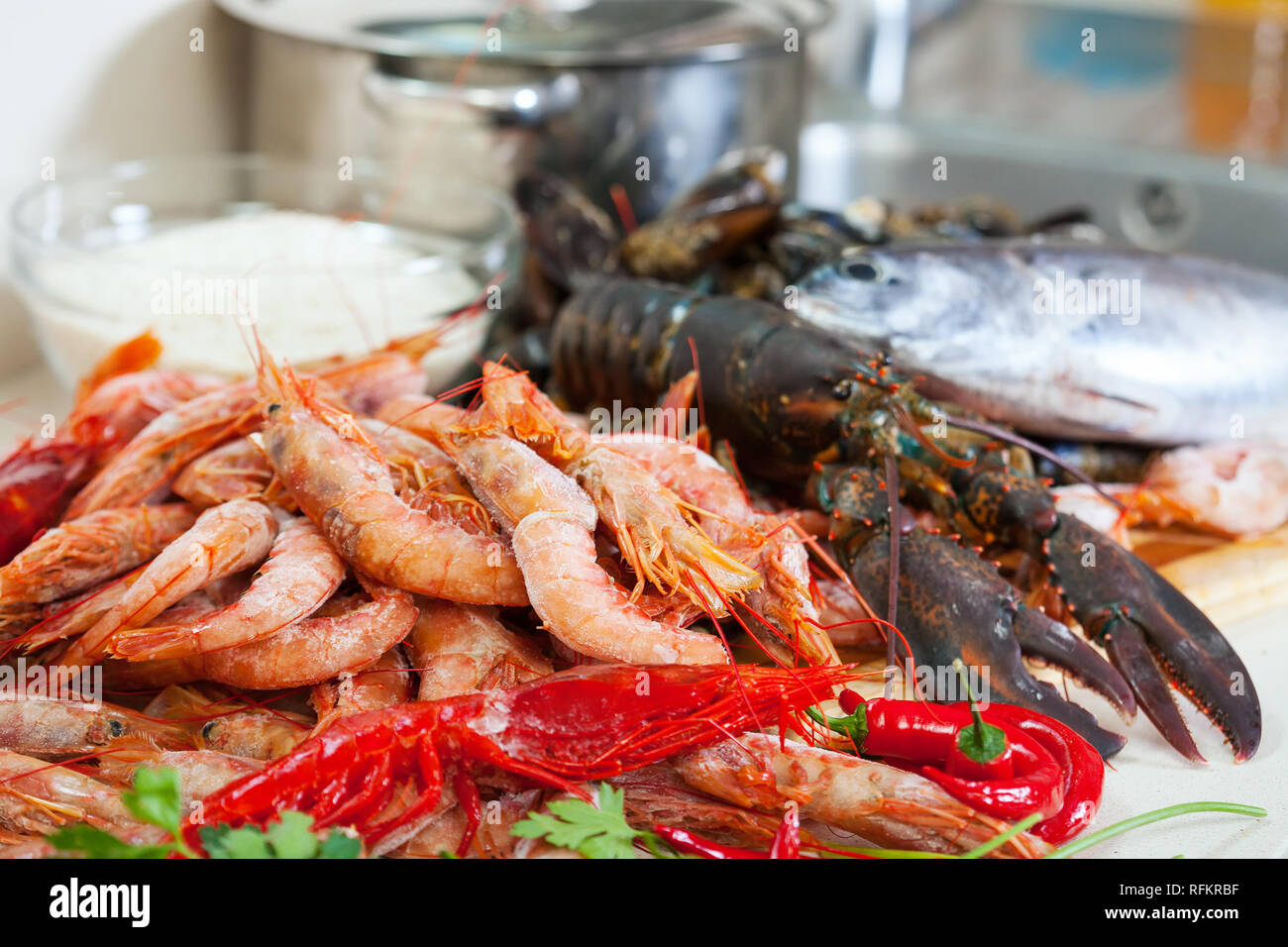 Fresh uncooked sea food specialties and rice ready for cooking Stock Photo