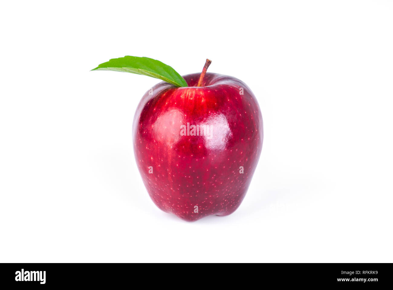 Red apple with green leaf on white background Stock Photo - Alamy