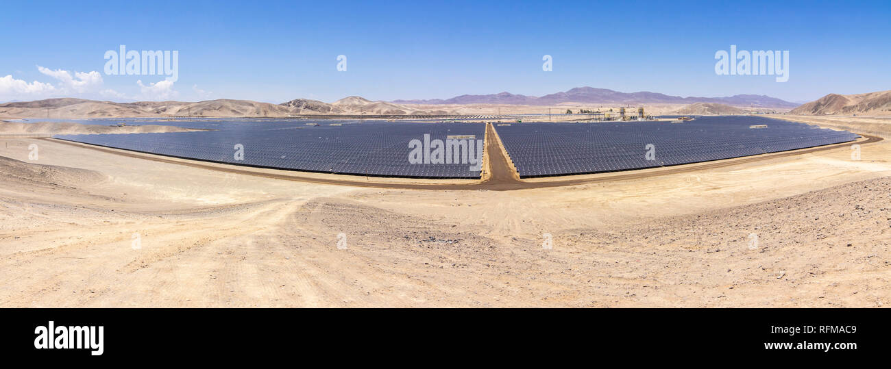 Solar Energy Photovoltaic Power Plant over Atacama desert sands, Chile. Sustainability and green energy from the sun with Solar Energy in arid climate Stock Photo
