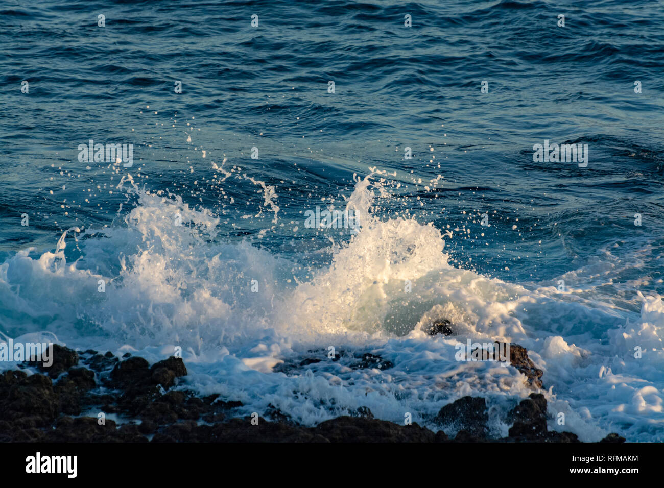 Background with dark blue ocean water waves close up on sunset Stock ...