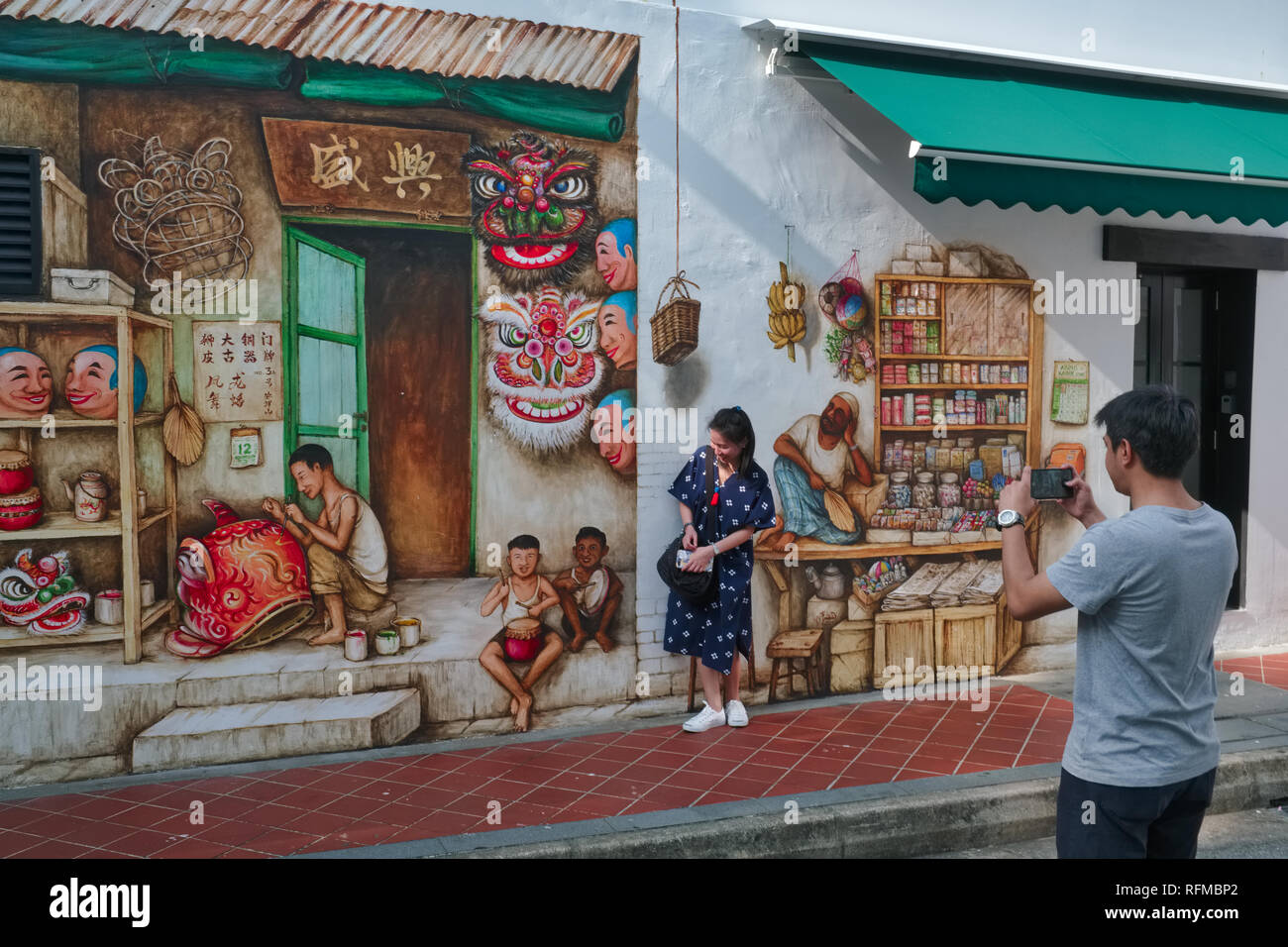 A wall painting by artist Yip Yew Chong in Mohamed Ali Lane, Chinatown