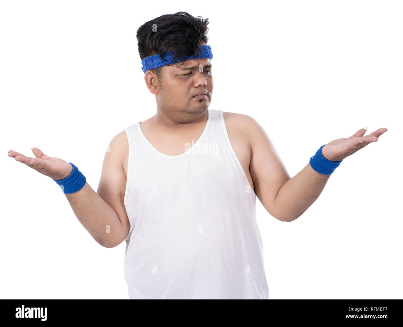 portrait of sporty fat young man raised his hand disappointed Stock Photo