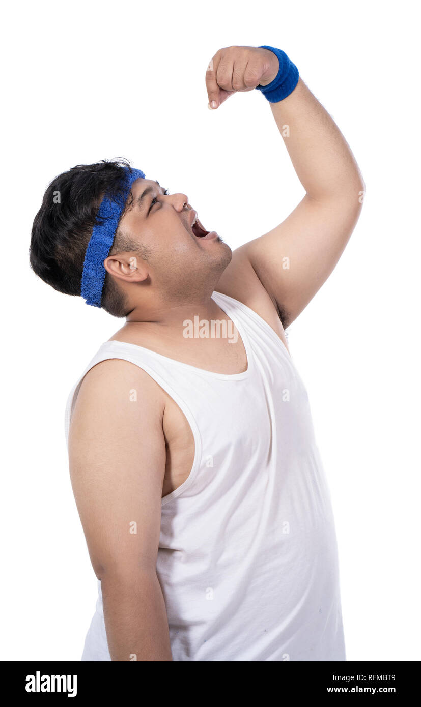 portrait of sporty young man looking up while eating pose Stock Photo