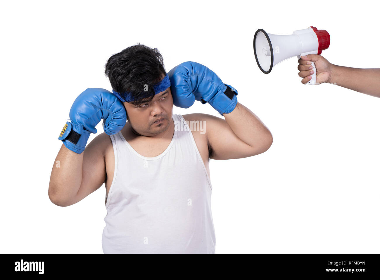 portrait of fat young man close his ears by hands and angry with boxing