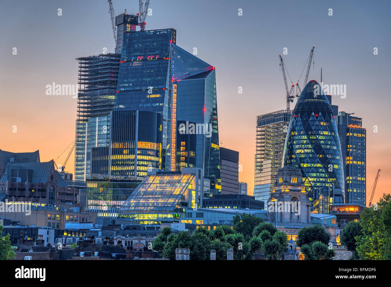 The skyscrapers of the City of London after sunset Stock Photo