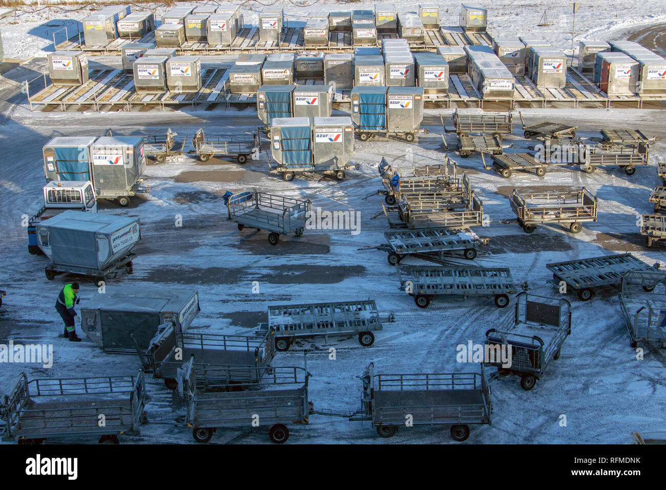KIEV, UKRAINE, NOV 28 2018, Containers with trolleys in the storage area at the winter airport. Stock Photo