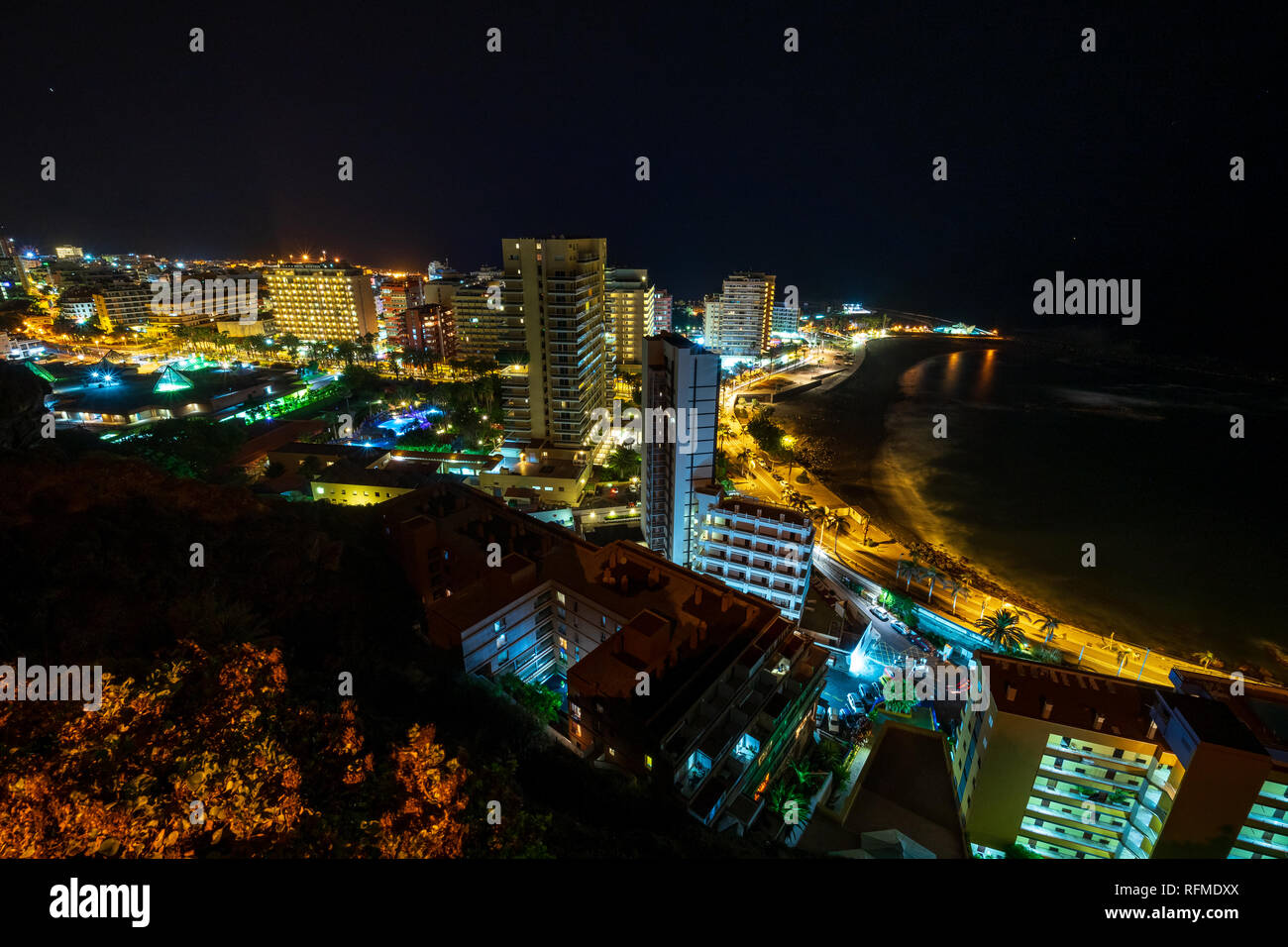 PUERTO DE LA CRUZ, CANARY ISLANDS, SPAIN - JULY 30, 2018: A view of the night city from a height. Viewpoint: Mirador La Paz. Stock Photo