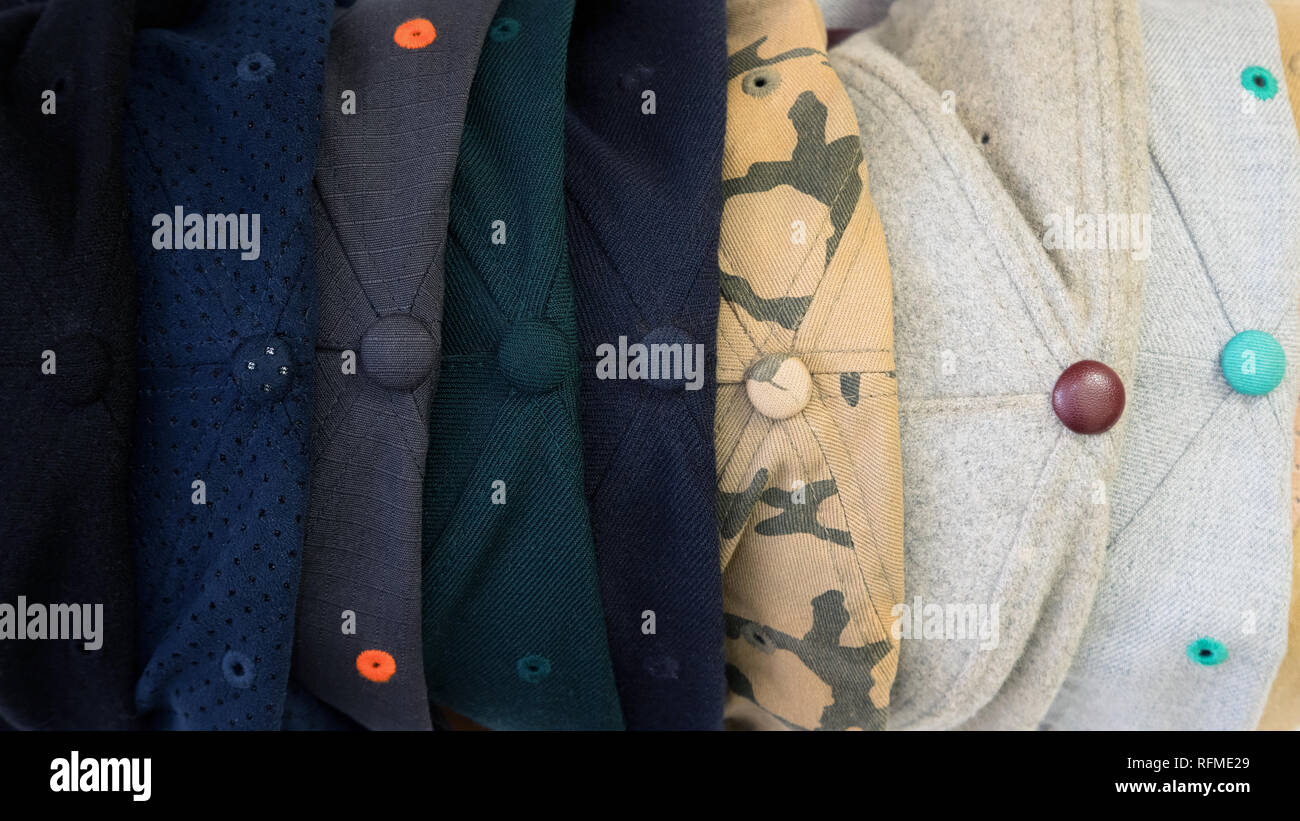 Top view of different snap back baseball caps with different textures