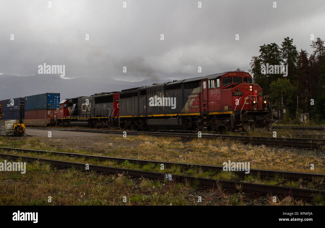 CN locomotives pulling out of Jasper on an Autumn day Stock Photo