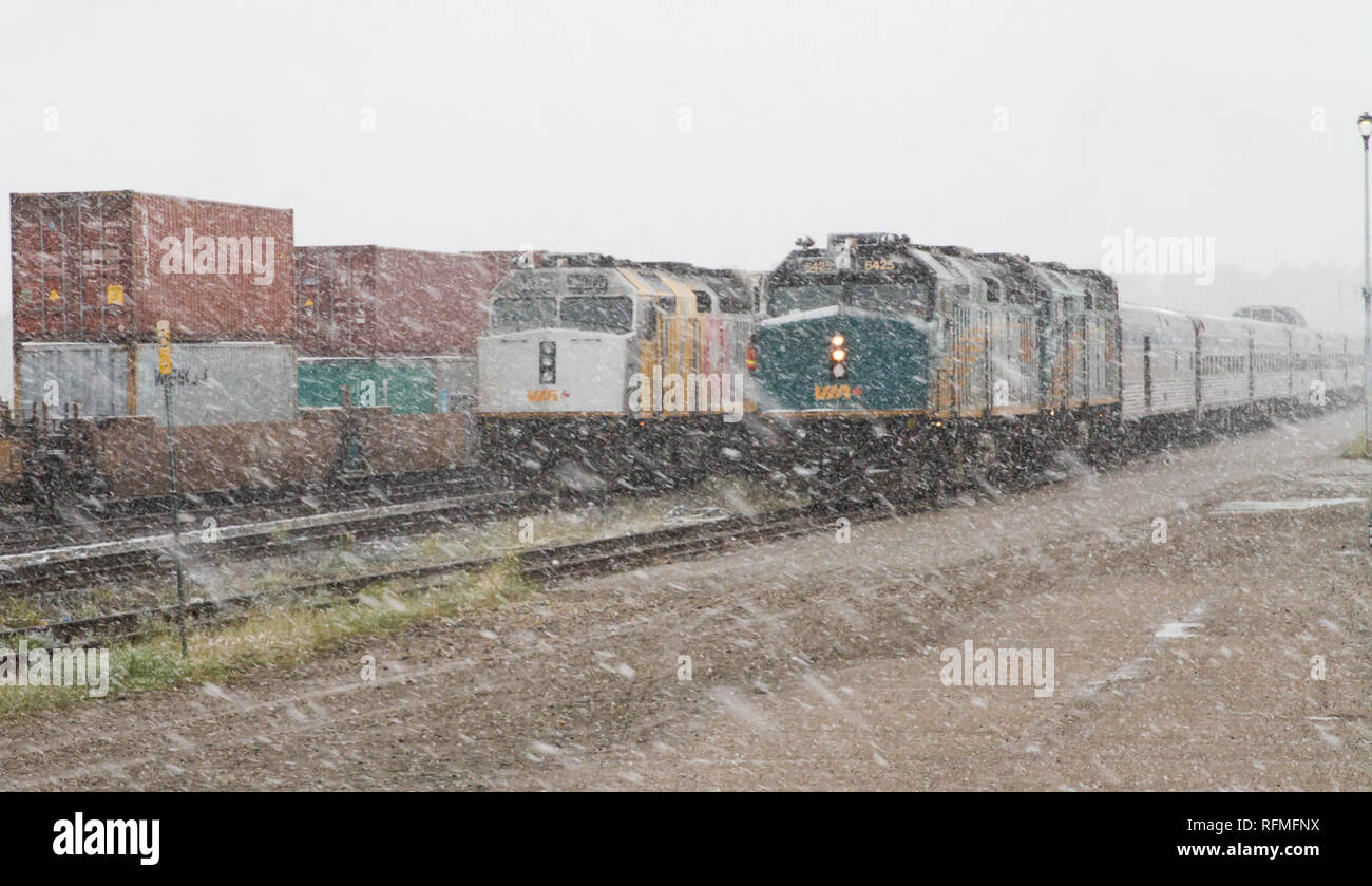VIA Rail locomotive at Jasper in a snow storm Stock Photo