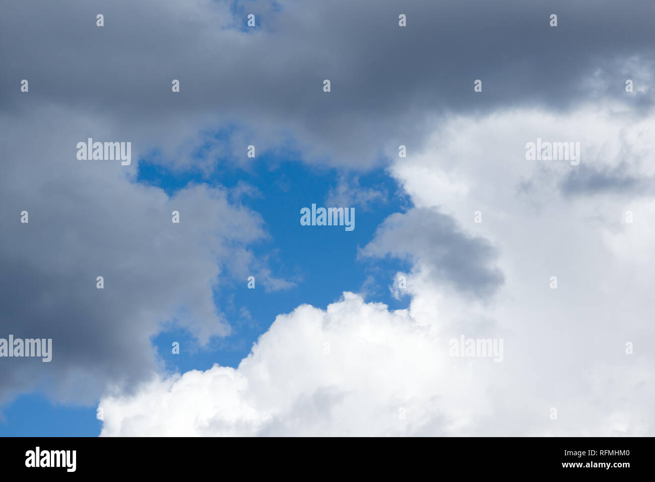 Blue sky with lots of white clouds Stock Photo