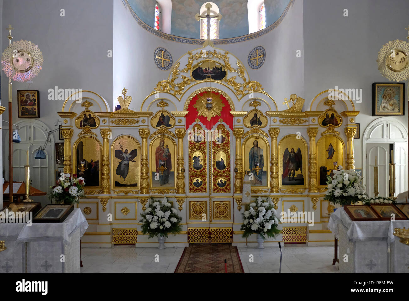 The iconostasis decorated with icons and religious paintings inside the ...