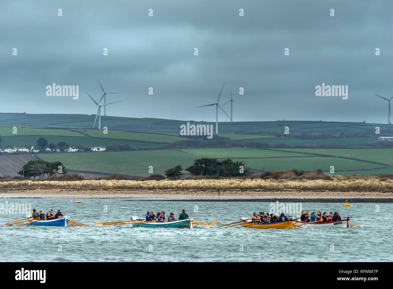 UK Weather - Saturday 26th January. On a cold overcast day in North Devon, Pilot Gig Boats gather at the quayside in the village of Appledore to do ba Stock Photo