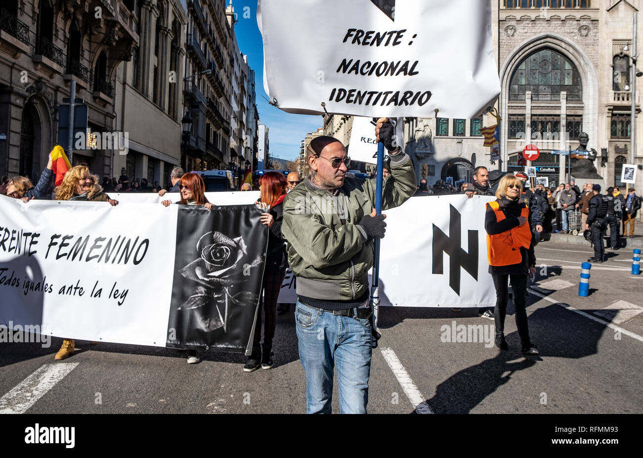 Members of the extreme right National Identity Front group are seen during the demonstration. Only a few followers have attended to the call of the ultra-right ‘We Recover Spain-National Identity Front’ that was intended to celebrate the 80th anniversary of the entry of Francoist troops in Barcelona that ended the Spanish Civil War. Antifascists occupied the Plaza Sant Jaume for one hour where it was intended to celebrate the commemoration. Finally the police intervened to stop the anti-fascist protest. Stock Photo