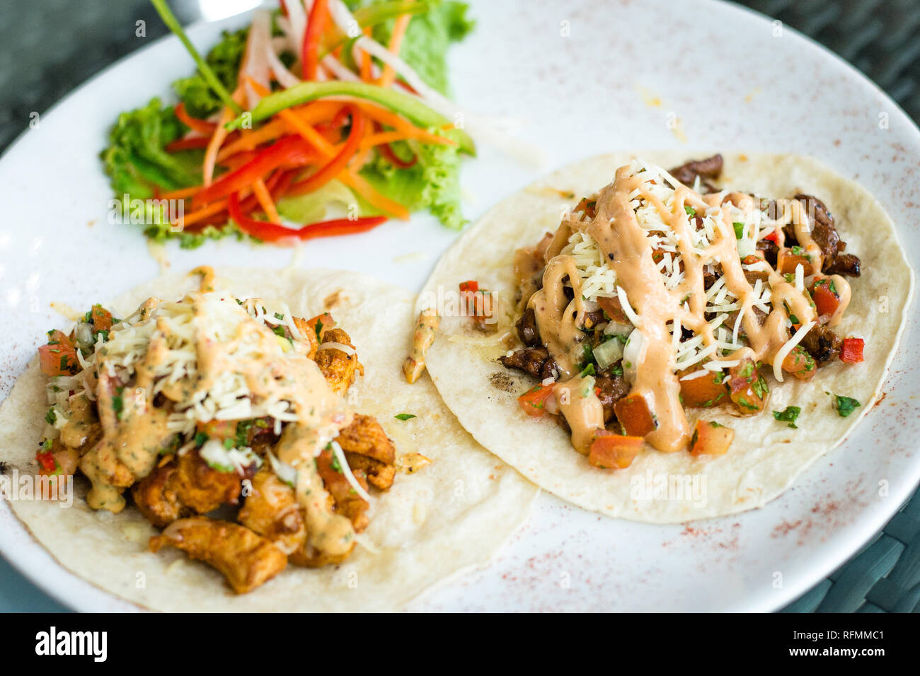 marinated beef taco with Texan BBQ mayo or Mexican jerk chicken taco