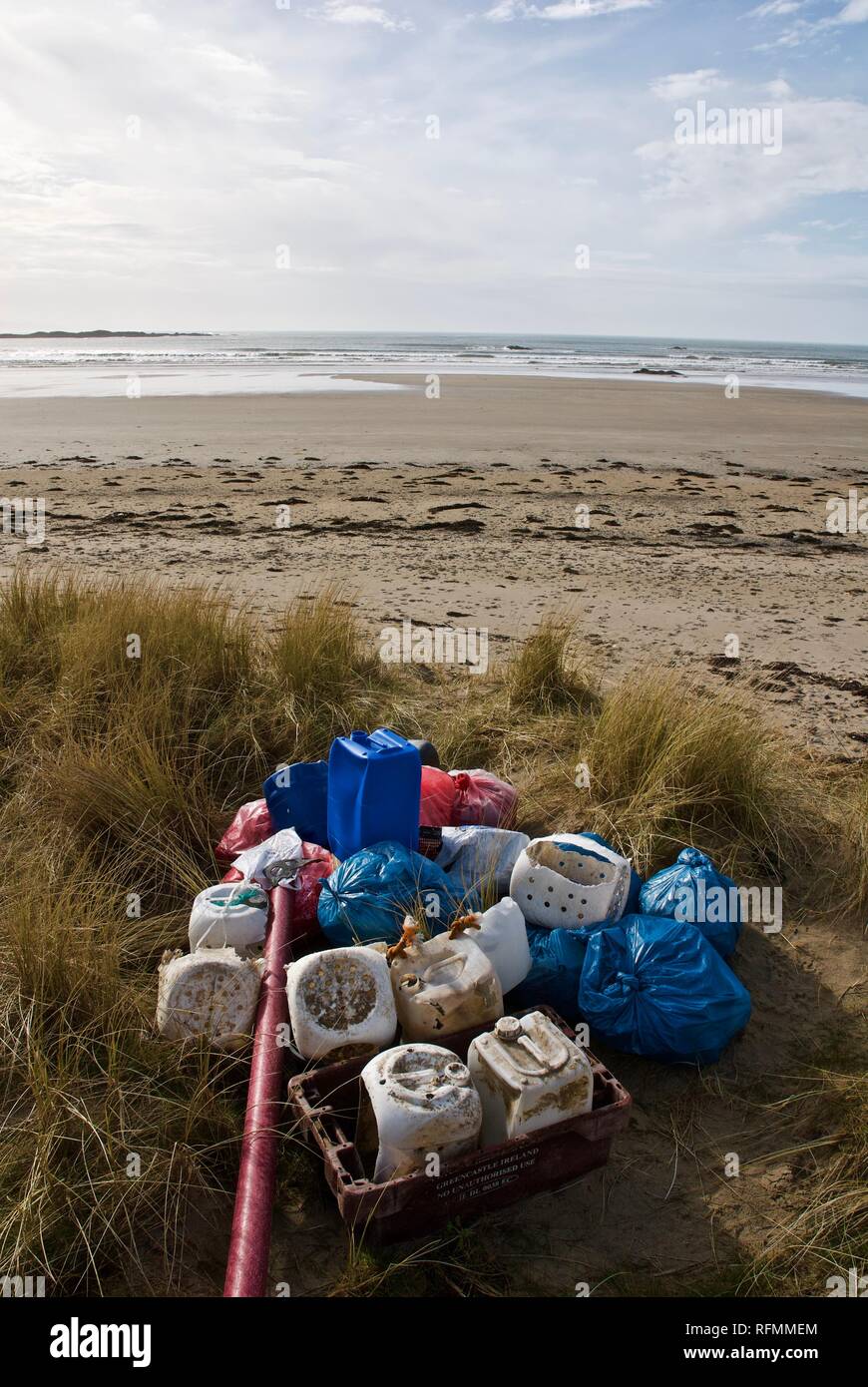 A beach collection of plastic waste and pollution washed up on a beach in Rhosneigr, Anglesey, North Wales, UK Stock Photo