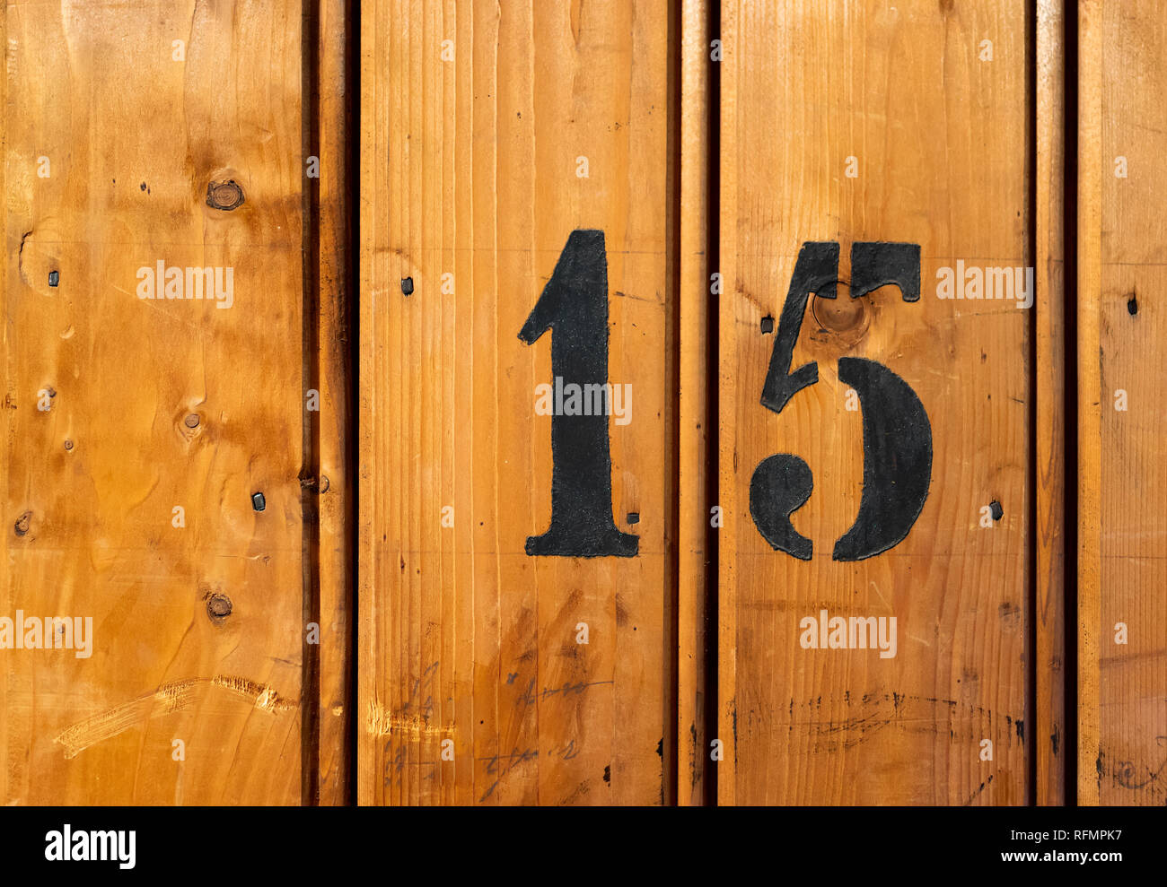 number 15 on door of storage room for tenants in century-old apartment building in stockholm Stock Photo