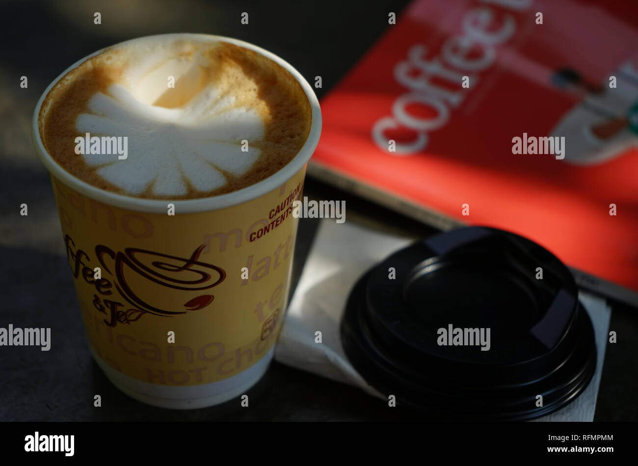A paper cup of cappuccino Stock Photo