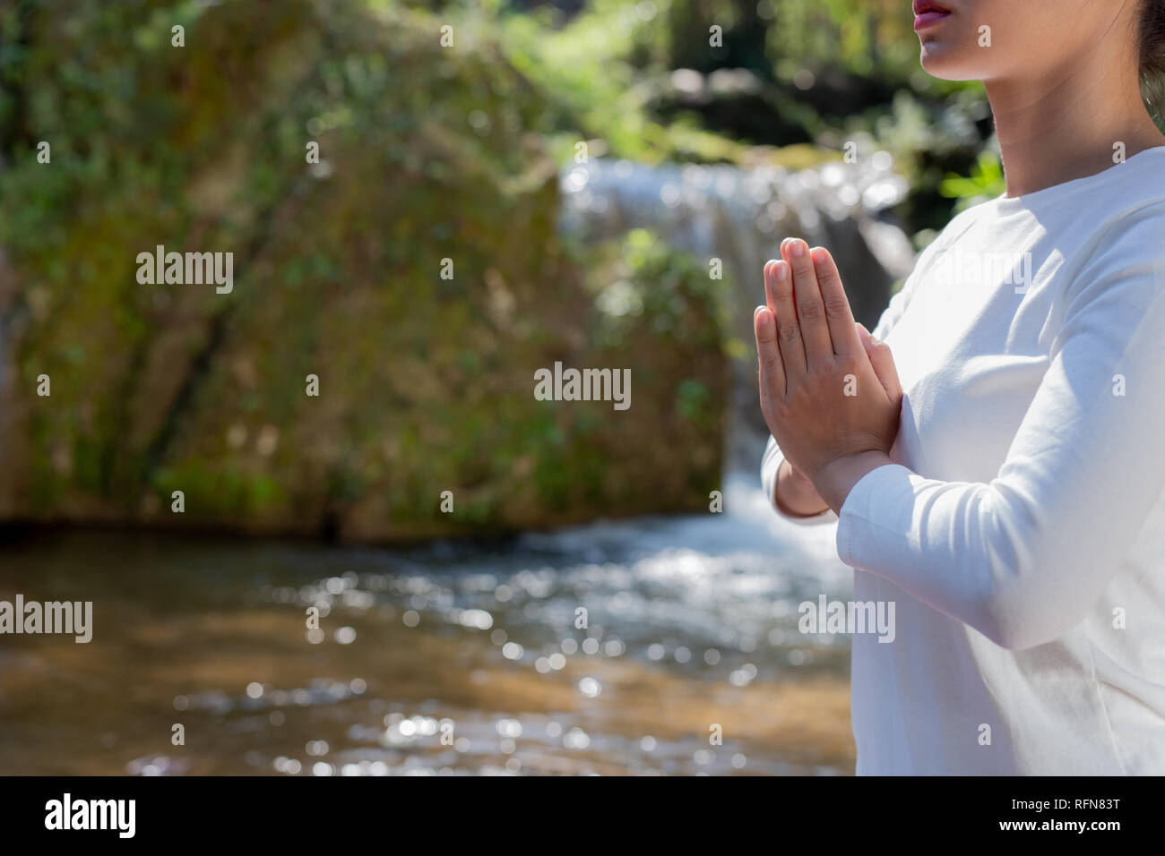 Beautiful girls are playing yoga at the park. Among the natural ...