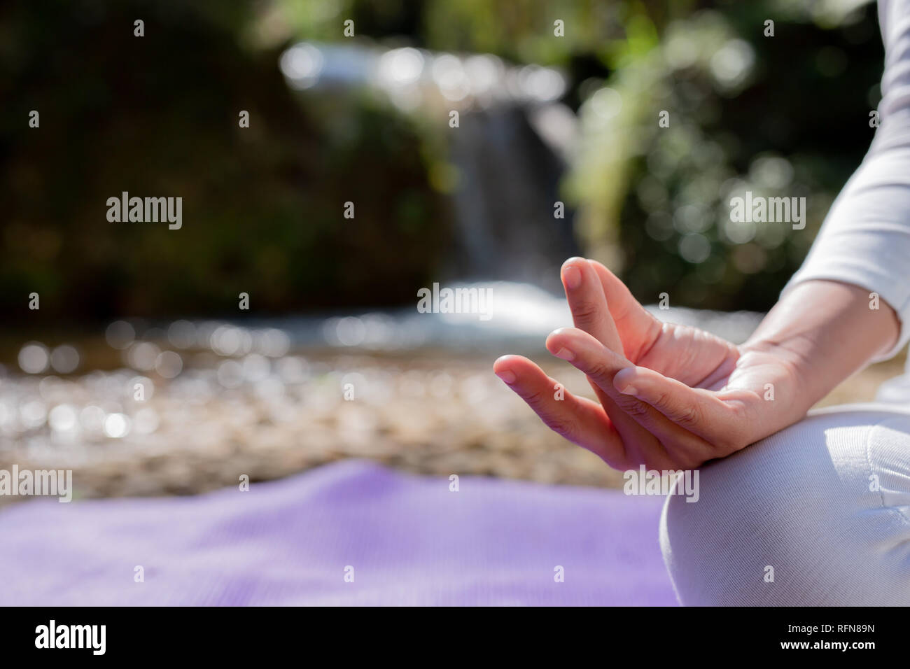 Beautiful girls are playing yoga at the park. Among the natural ...