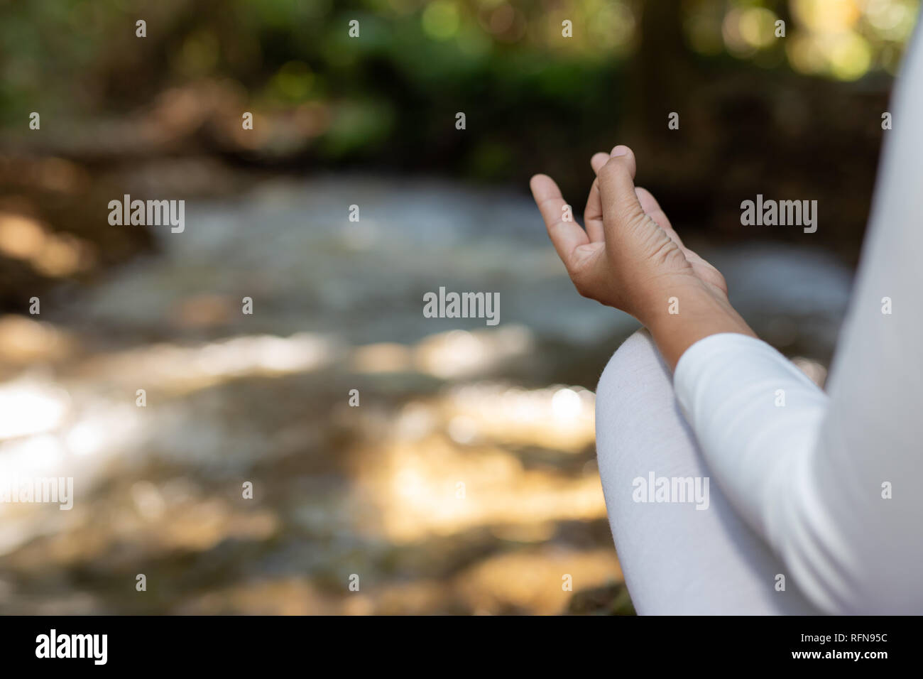 Beautiful girls are playing yoga at the park. Among the natural ...