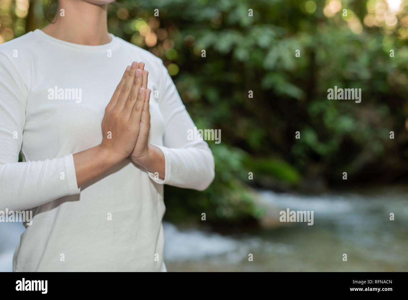 Beautiful girls are playing yoga at the park. Among the natural ...