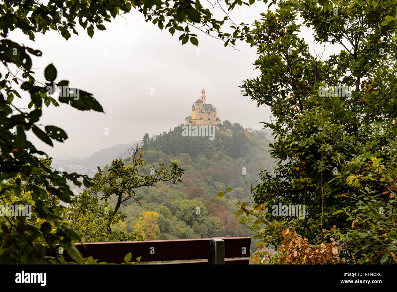 beautiful view over 'Marksburg' castle in autumn against foggy sky Stock Photo