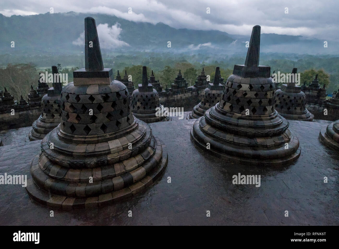 It's a rainy sunrise over Borobudur temple in Java, Indonesia. Stock Photo