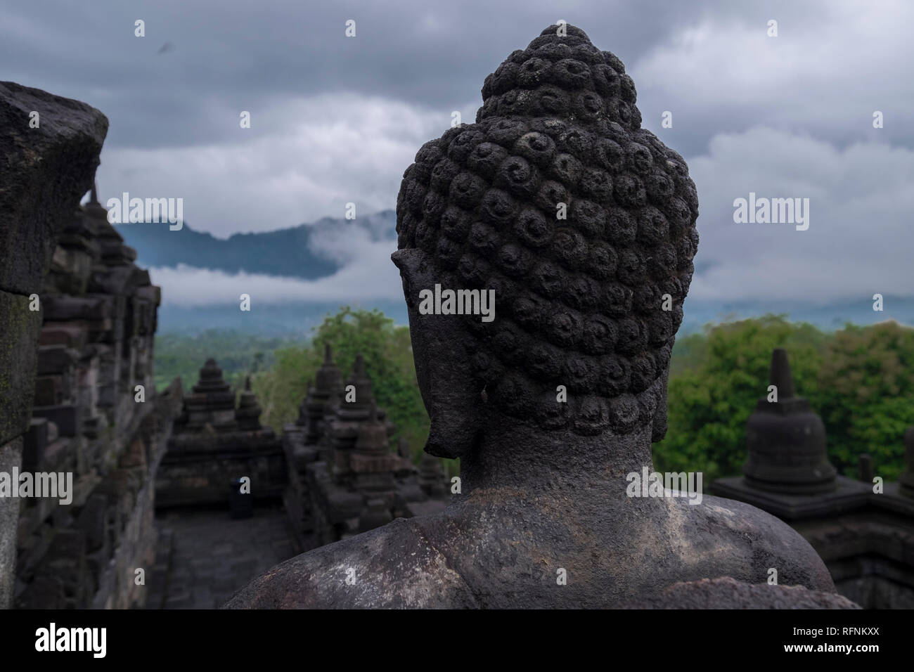Looking from behind a Buddha head at Borobudur temple in Java, Indonesia. Stock Photo
