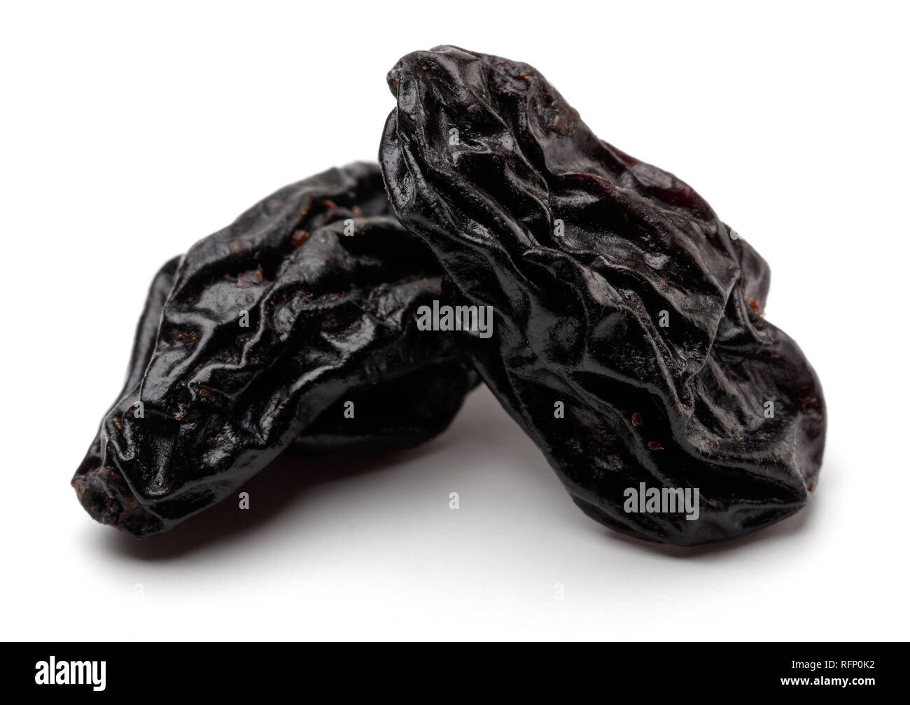 Black raisins isolated on white background Stock Photo