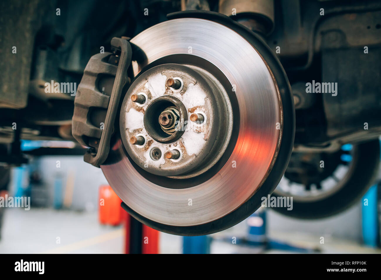 Close up of car disc brake during the wheel tire change or repair. Disc