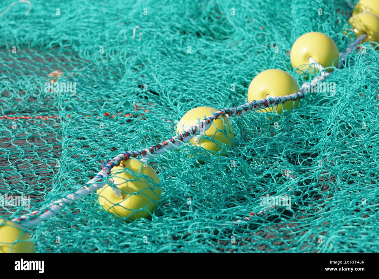 Fishing net spread for drying Stock Photo Alamy