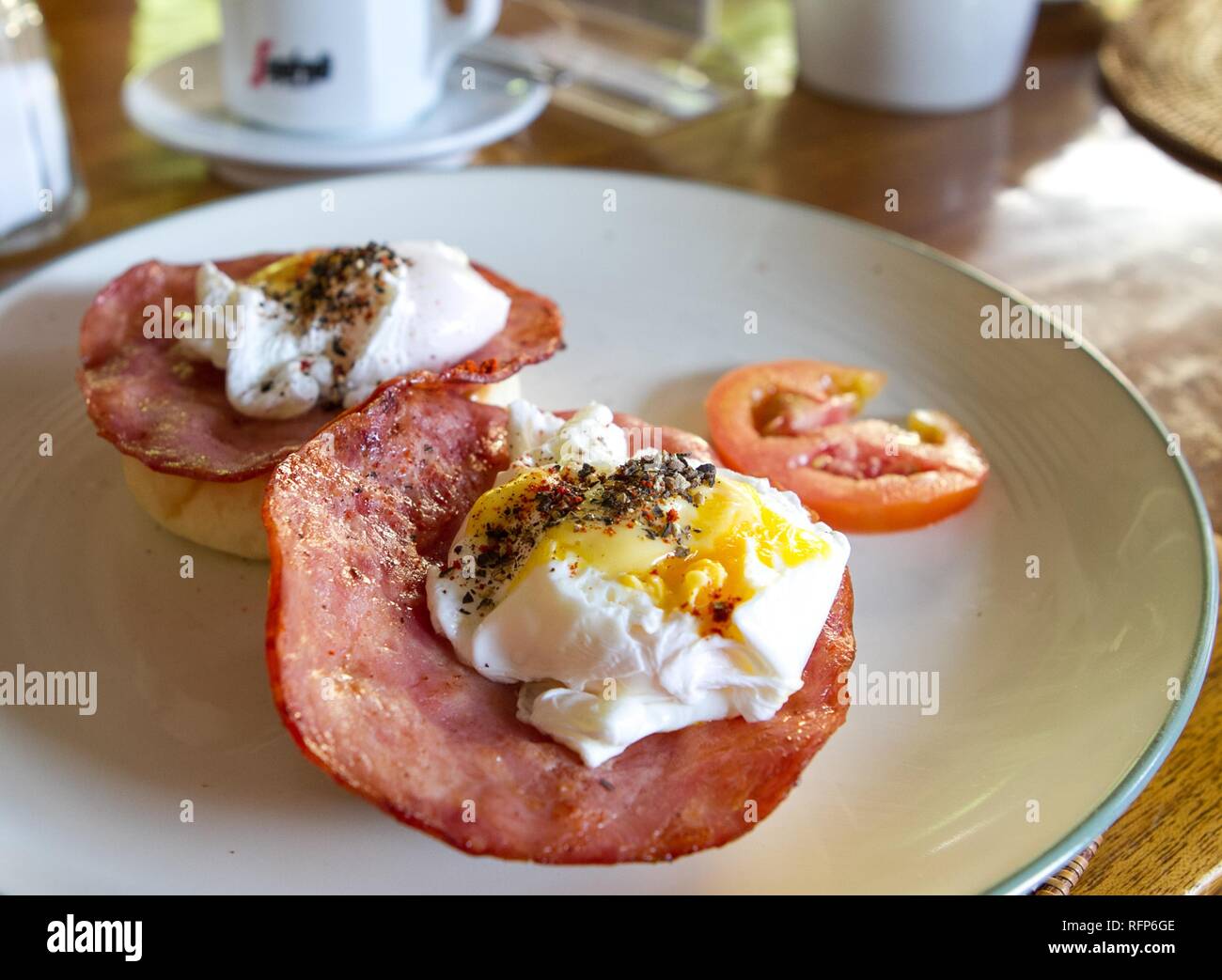 Breakfast with poached eggs and ham Stock Photo - Alamy