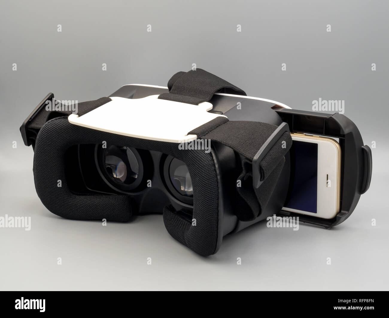 Packshot image of smartphone and virtual reality headset (VR Box) on gray background Stock Photo