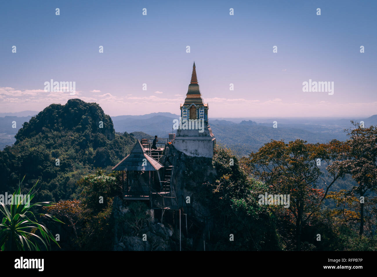 Wat Chaloemphrakiat in Thailand. Beautiful temple without tourists. Hidden gem in thailand. Men is praying at the Temple Stock Photo