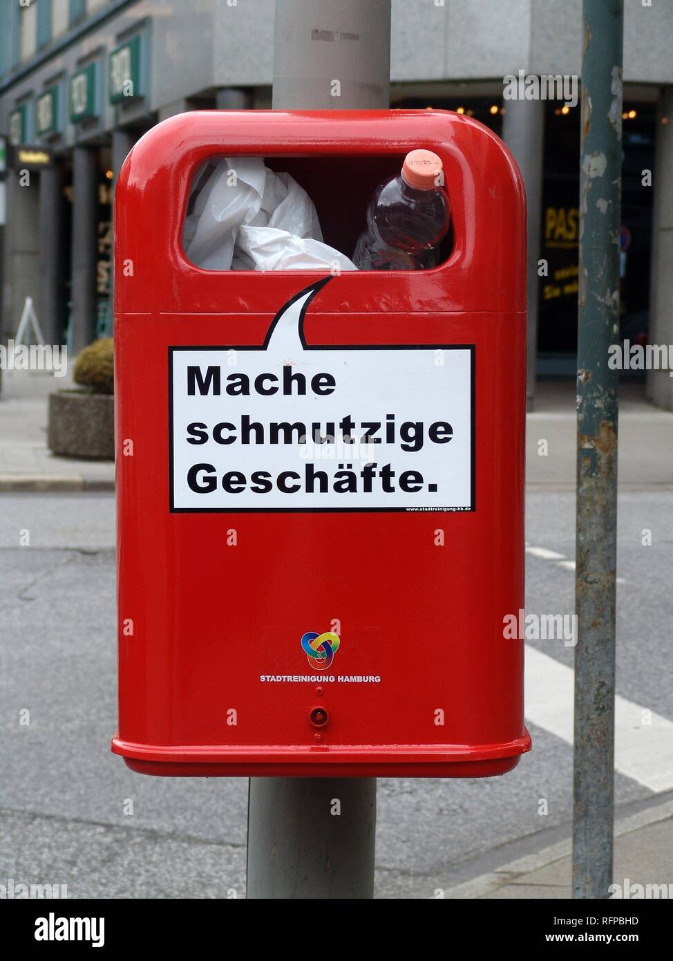 DEU, Germany, Hamburg : Waste bin, garbadge bin in the city center with a funny slogan 'making dirty business'. Stock Photo