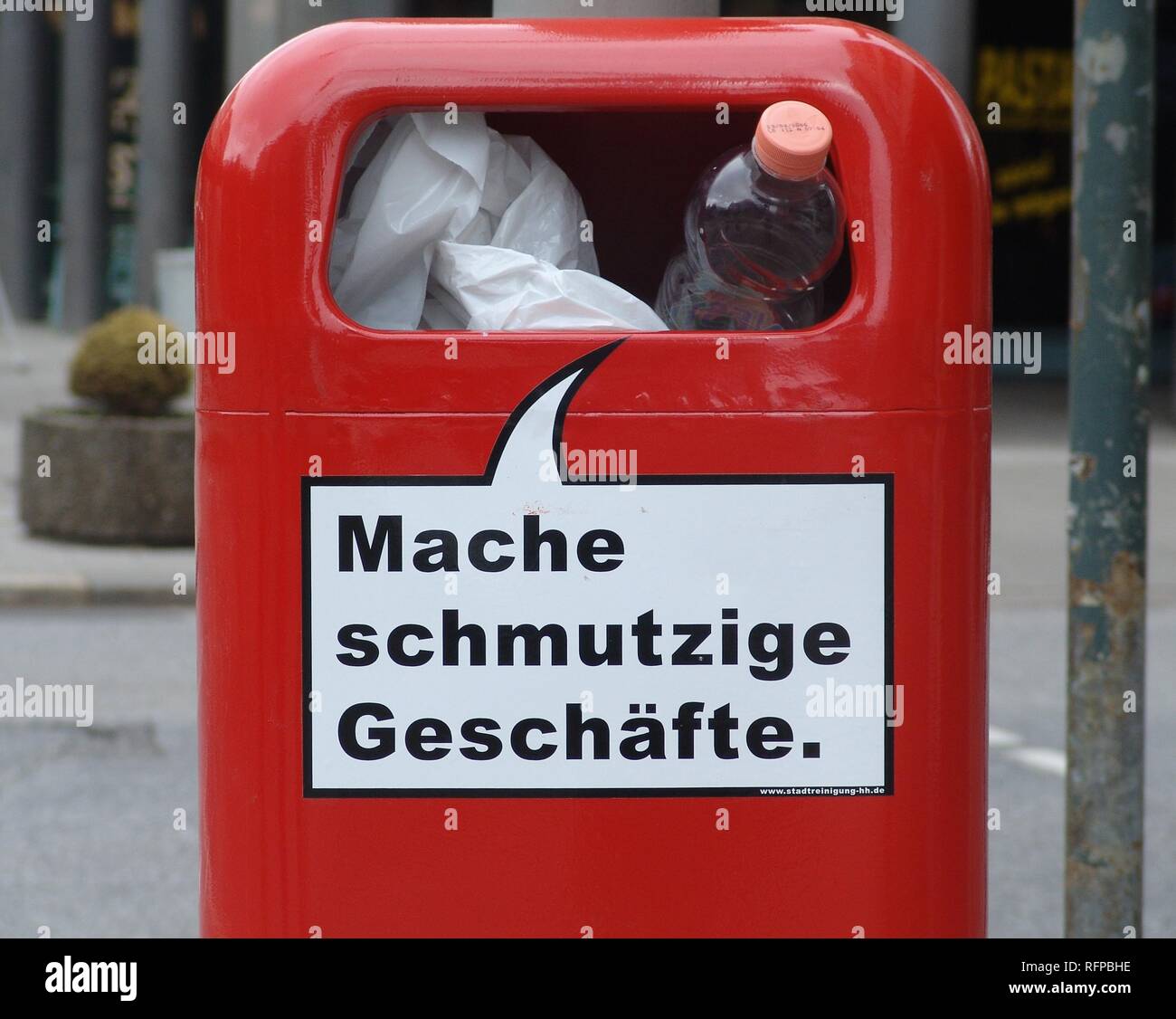 DEU, Germany, Hamburg : Waste bin, garbadge bin in the city center with a funny slogan 'making dirty business'. Stock Photo