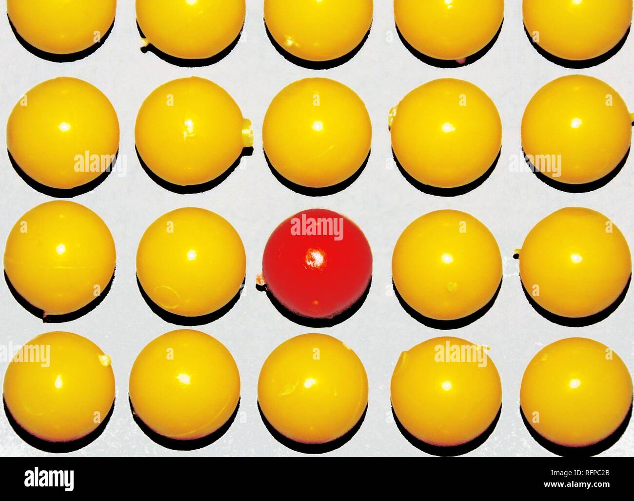 red-ball-in-center-of-yellow-balls-stock-photo-alamy