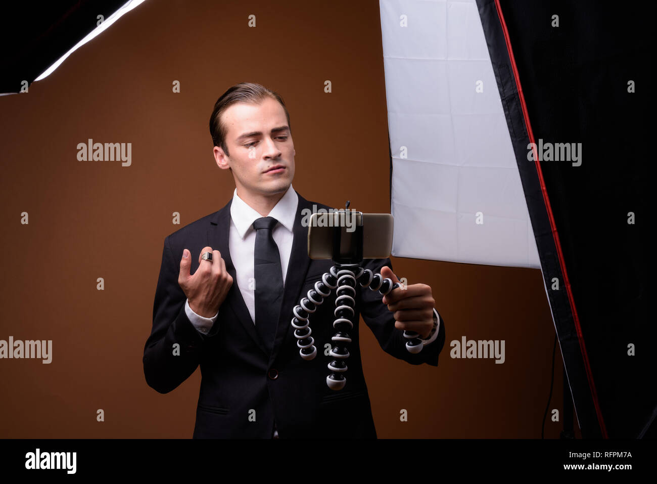 Portrait of young Caucasian businessman wearing suit Stock Photo - Alamy