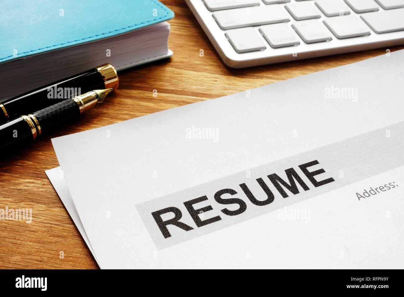 Resume on a desk. Recruiting and hiring. Looking for the job. Stock Photo