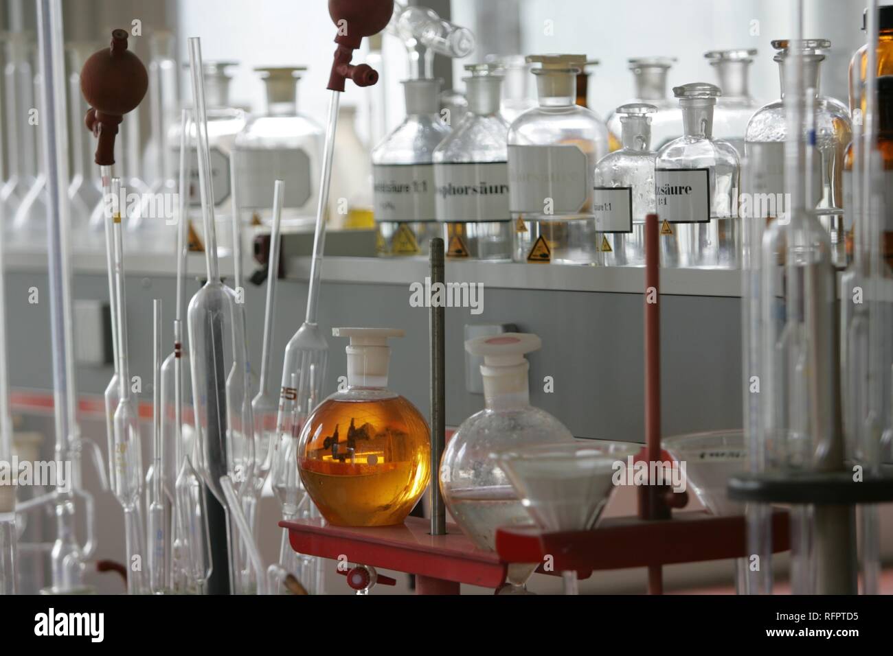 DEU, Germany: Bottles, apparatus, chemical in a chemical laboratory. Stock Photo