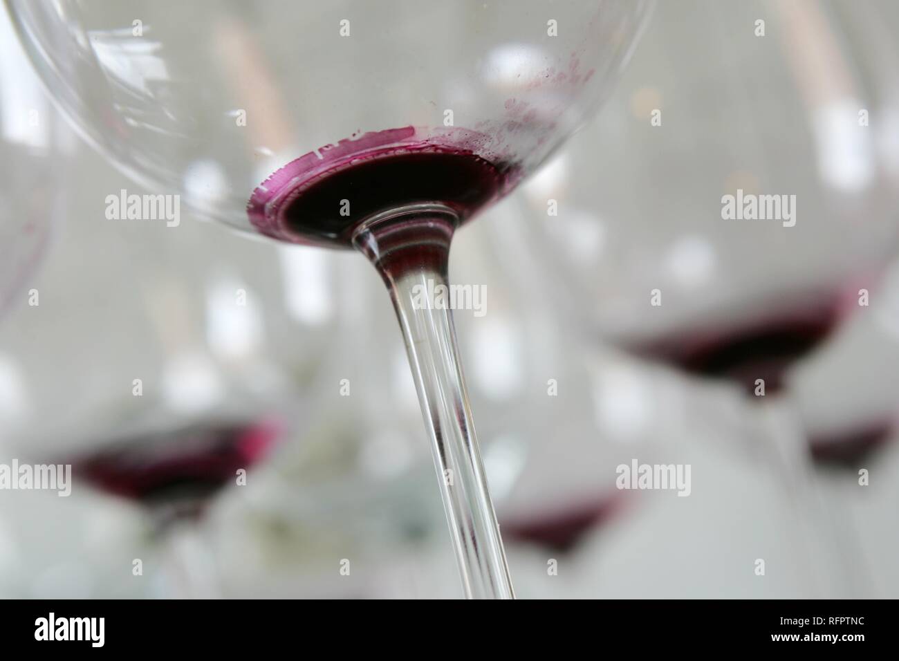 DEU, Germany: Used, dirty redwine glasses waiting for claening. Stock Photo