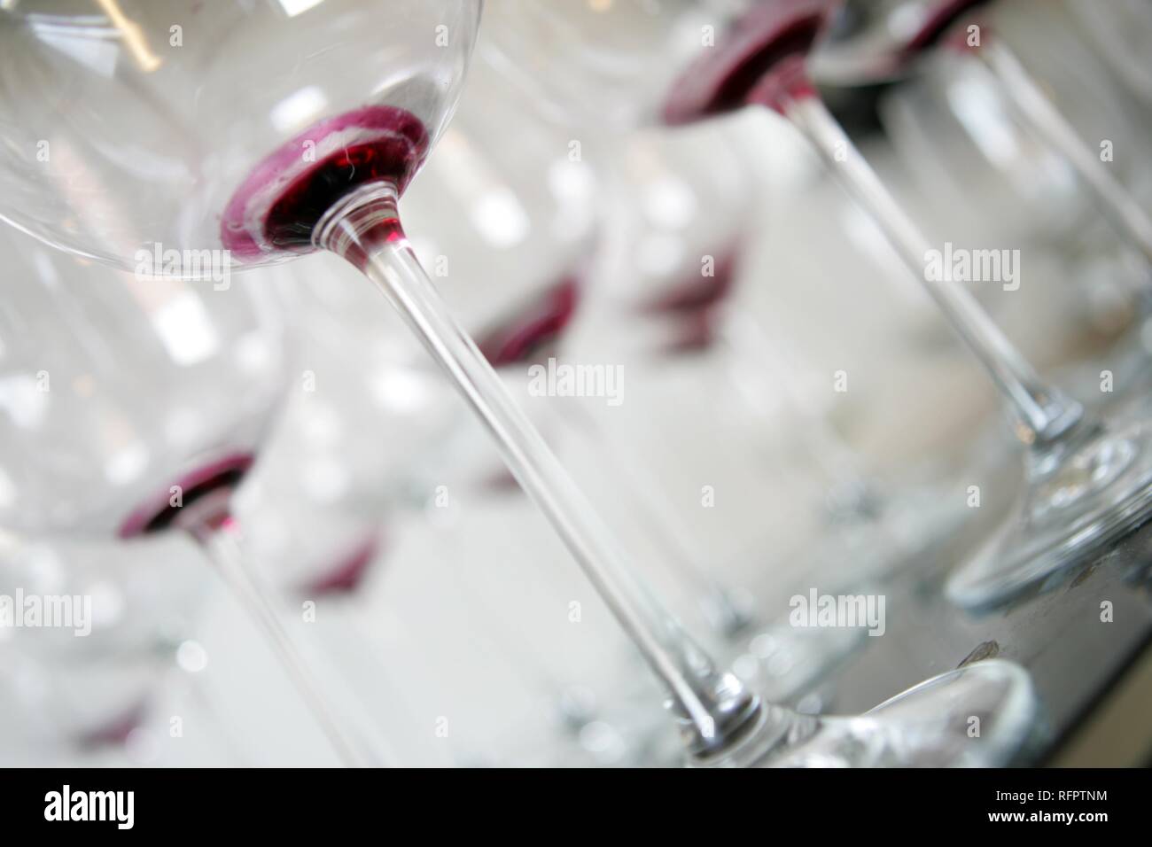 DEU, Germany: Used, dirty redwine glasses waiting for claening. Stock Photo