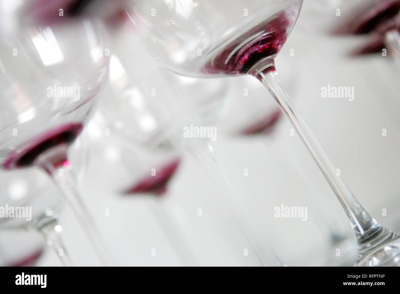 DEU, Germany: Used, dirty redwine glasses waiting for claening. Stock Photo