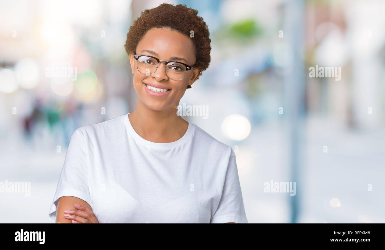 Beautiful young african american woman wearing glasses over isolated ...