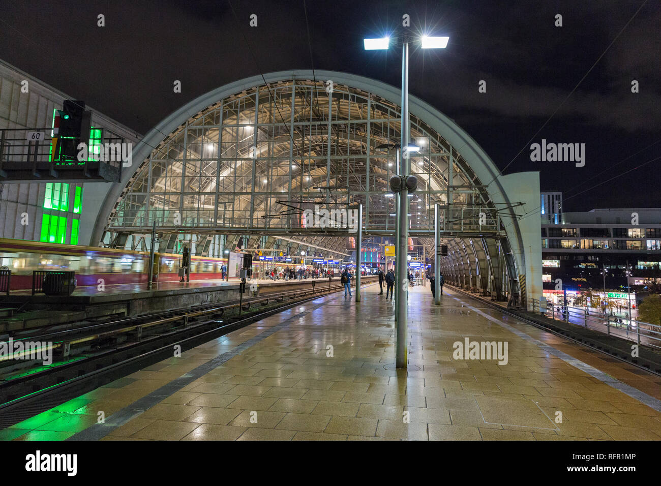 BERLIN, GERMANY - NOVEMBER 13, 2018: People on night platform of Alexanderplatz Bahnhof metro station. Berlin is the capital and German largest city b Stock Photo