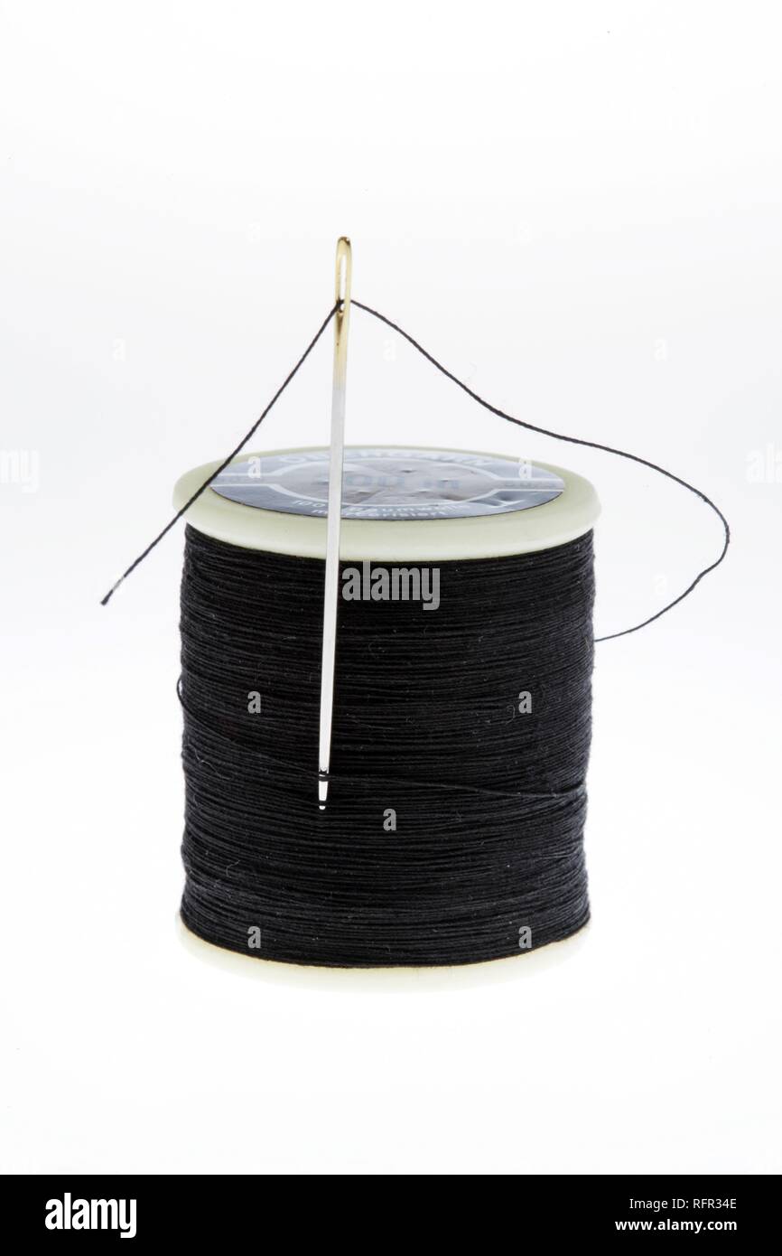 Spool Of Black Thread On White Shirt With Needle, Needle Is Threaded Stock  Photo, Picture and Royalty Free Image. Image 2192890.
