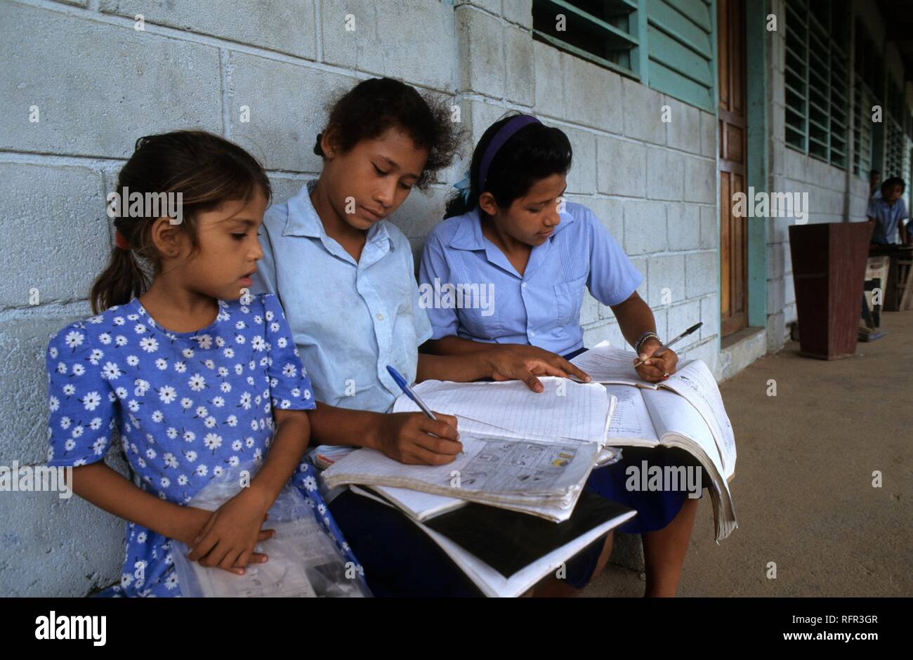 Schoolgirls doing their homework, Palacios, Moskitia, eastern Caribbean coast, Honduras Stock Photo